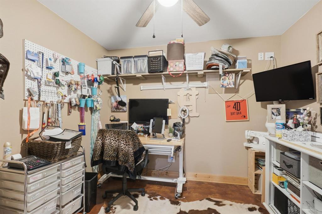 6499 Summerhill Road Abilene, TX 79601 - Photo 13 of 36 a living room with furniture and a flat screen tv