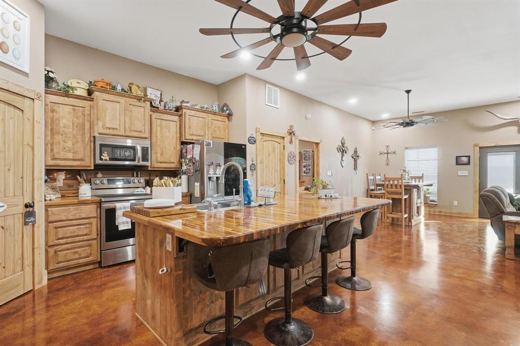 6499 Summerhill Road Abilene, TX 79601 - Photo 17 of 36 a large kitchen with a table and chairs
