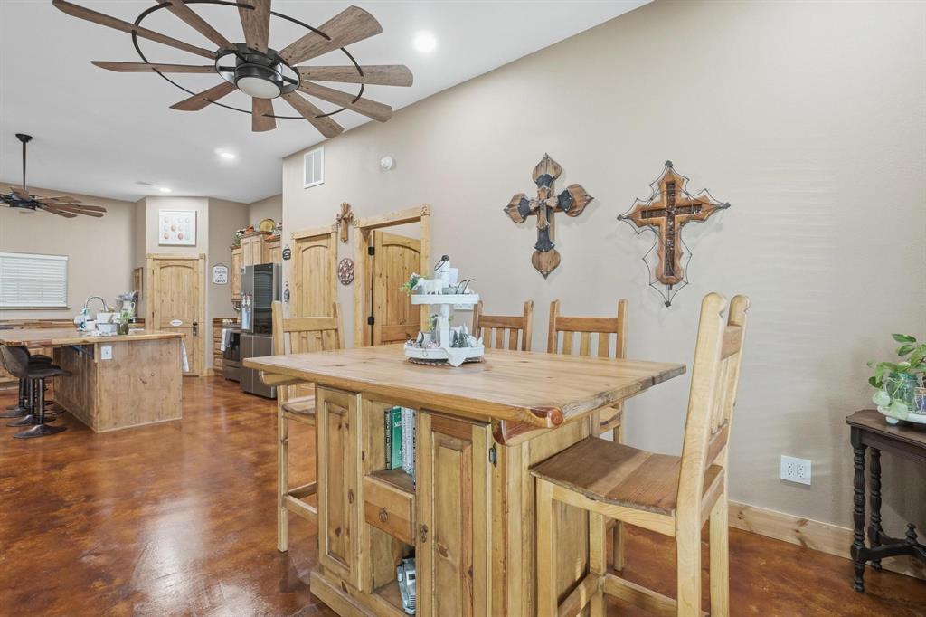 6499 Summerhill Road Abilene, TX 79601 - Photo 18 of 36 a view of a dining room with furniture and wooden floor