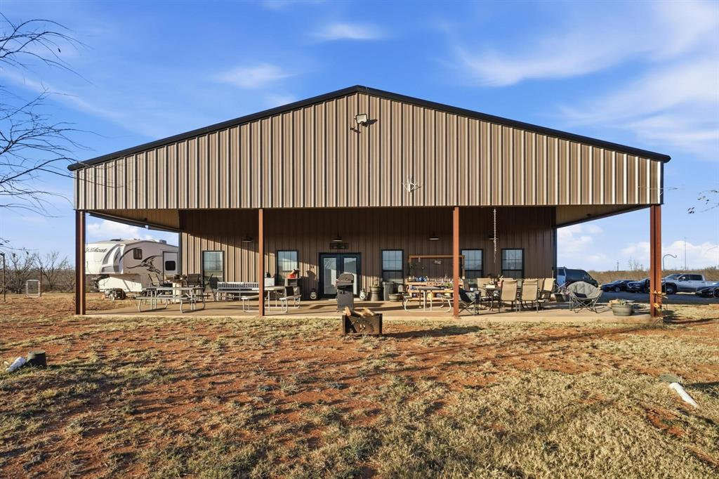 6499 Summerhill Road Abilene, TX 79601 - Photo 4 of 36 a backyard of a house with garden and patio