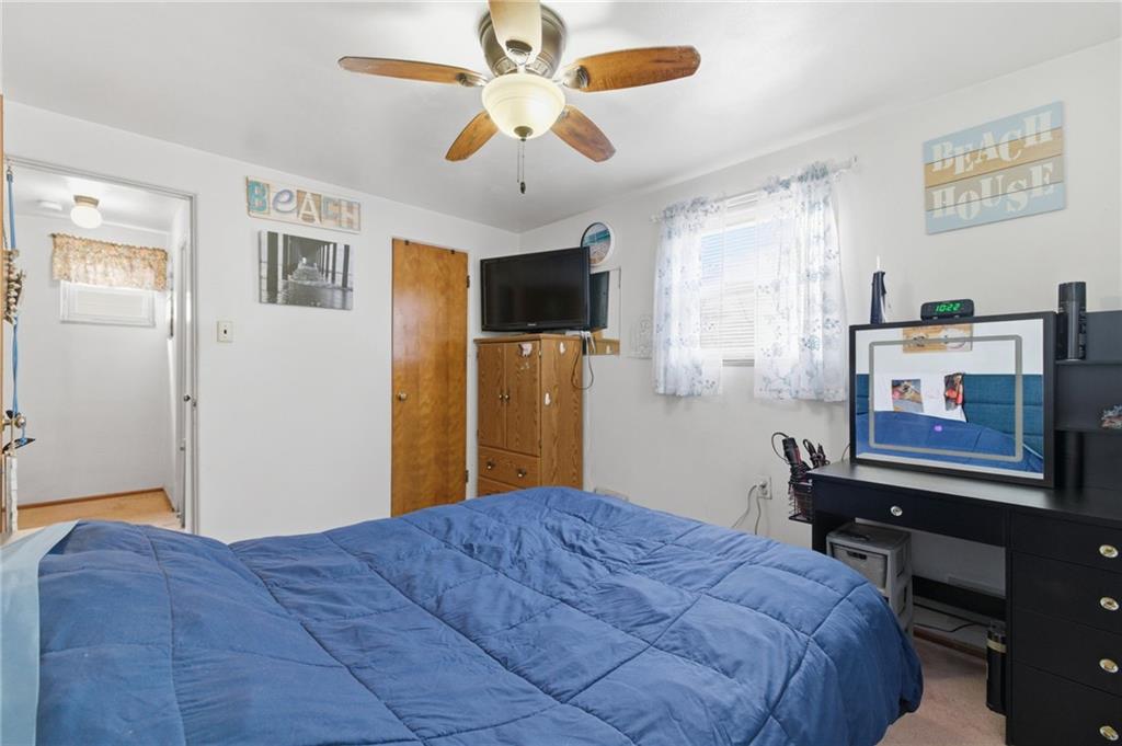 117 Overbrook Boulevard Pittsburgh, PA 15210 - Photo 17 of 30 a bedroom with a bed dresser and a window