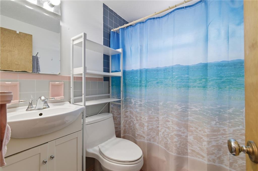 117 Overbrook Boulevard Pittsburgh, PA 15210 - Photo 18 of 30 a bathroom with a sink a toilet and shower