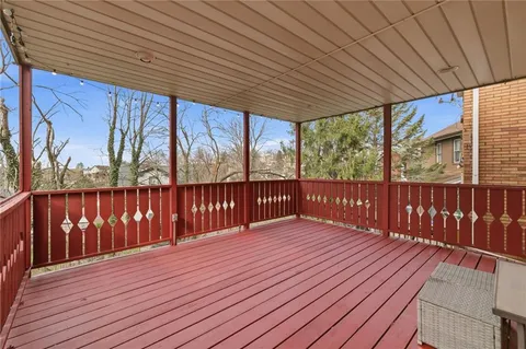 a balcony with wooden floor
