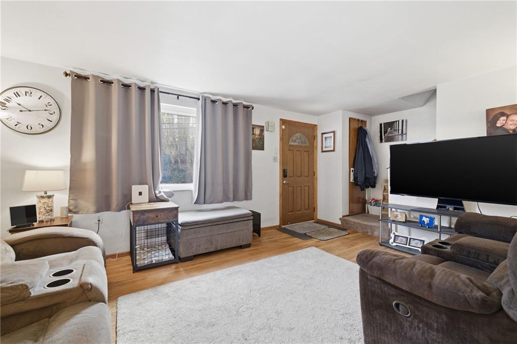 117 Overbrook Boulevard Pittsburgh, PA 15210 - Photo 4 of 30 a living room with furniture and a flat screen tv