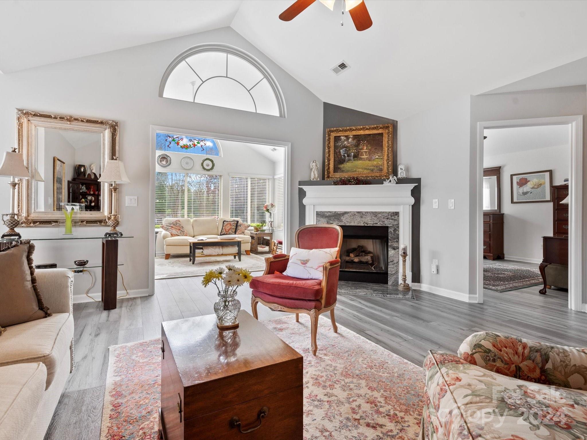 707 Ledgestone Court Fort Mill, SC 29708 - Photo 11 of 40 a living room with furniture and a fireplace
