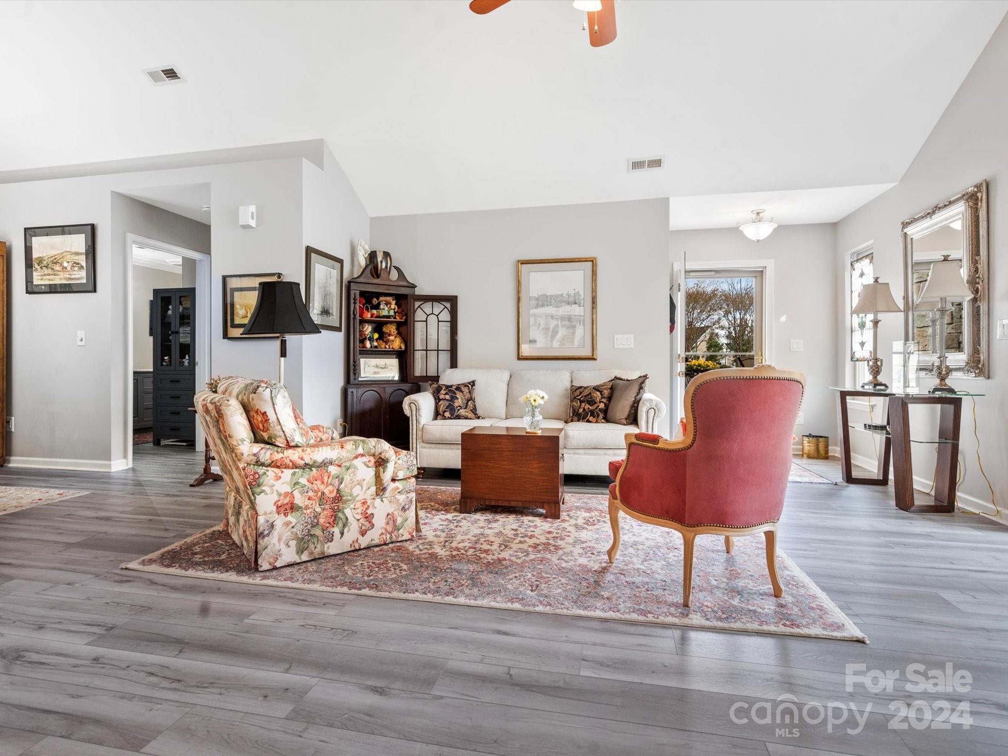 707 Ledgestone Court Fort Mill, SC 29708 - Photo 13 of 40 a living room with furniture and a wooden floor