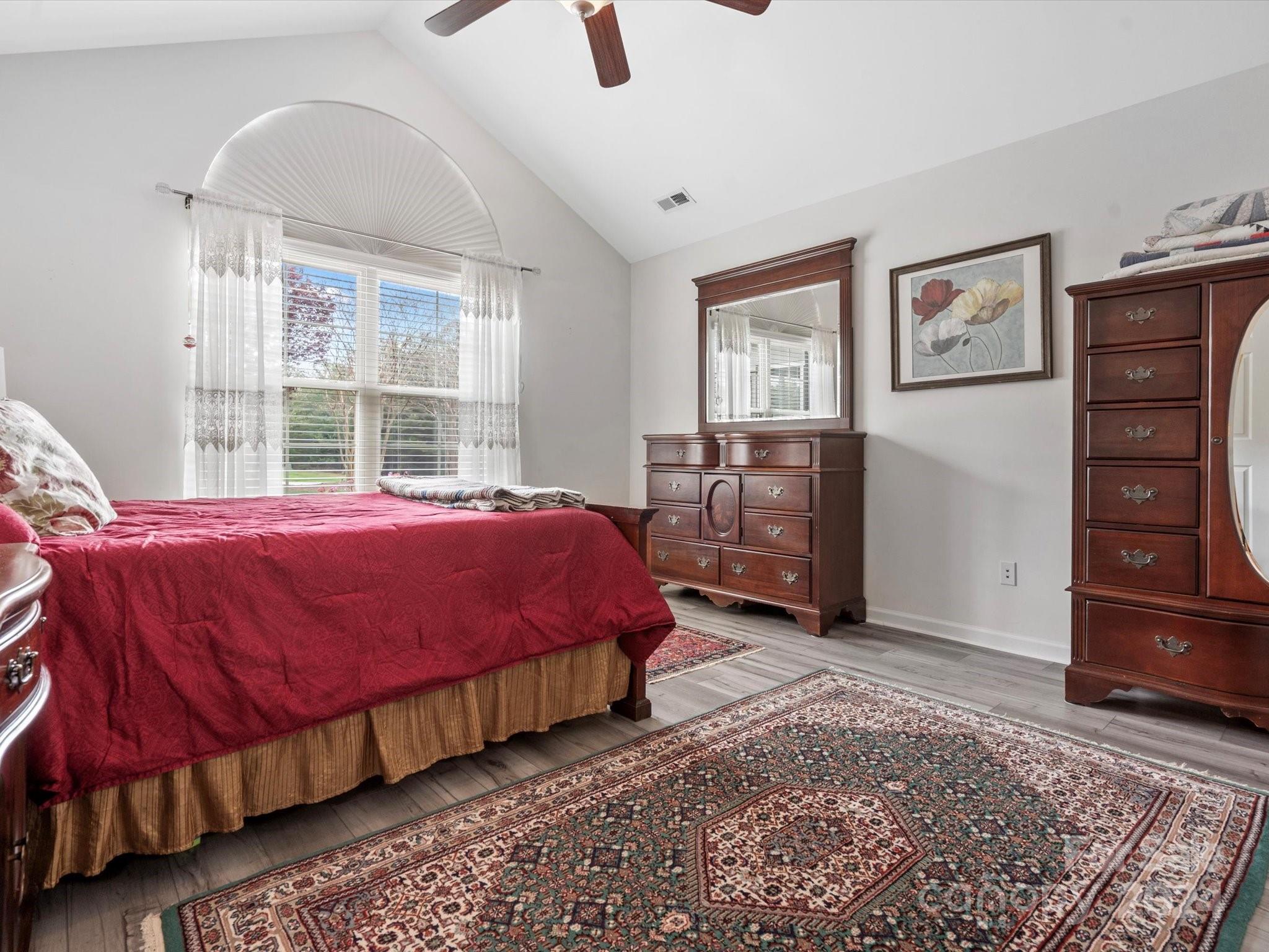 707 Ledgestone Court Fort Mill, SC 29708 - Photo 19 of 40 a bed room with a bed and dresser