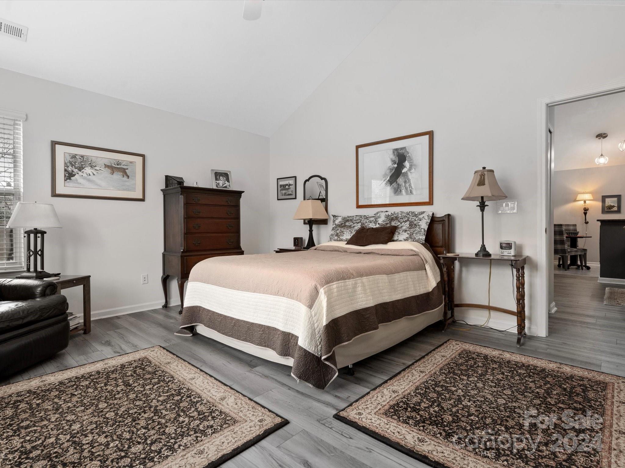 707 Ledgestone Court Fort Mill, SC 29708 - Photo 22 of 40 a bedroom with a bed rug and wooden floor