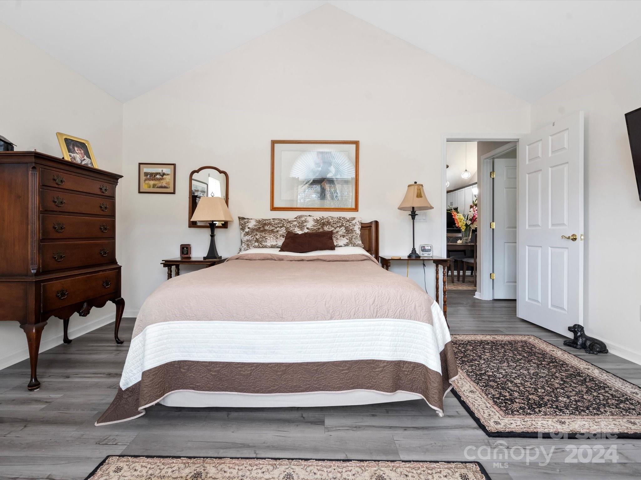 707 Ledgestone Court Fort Mill, SC 29708 - Photo 23 of 40 a bedroom with a bed and dresser with mirror