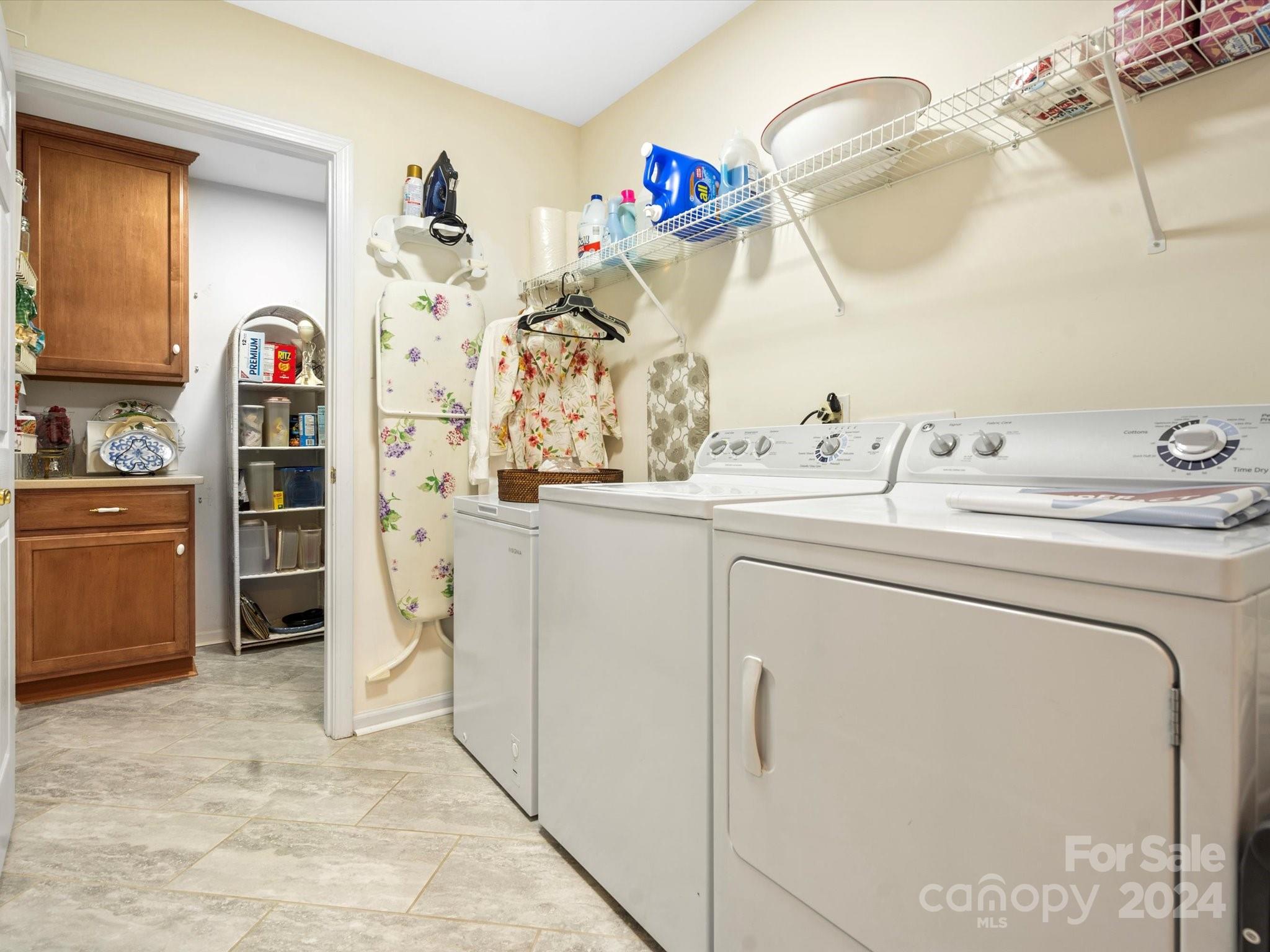707 Ledgestone Court Fort Mill, SC 29708 - Photo 26 of 40 a utility room with cabinets washer and dryer