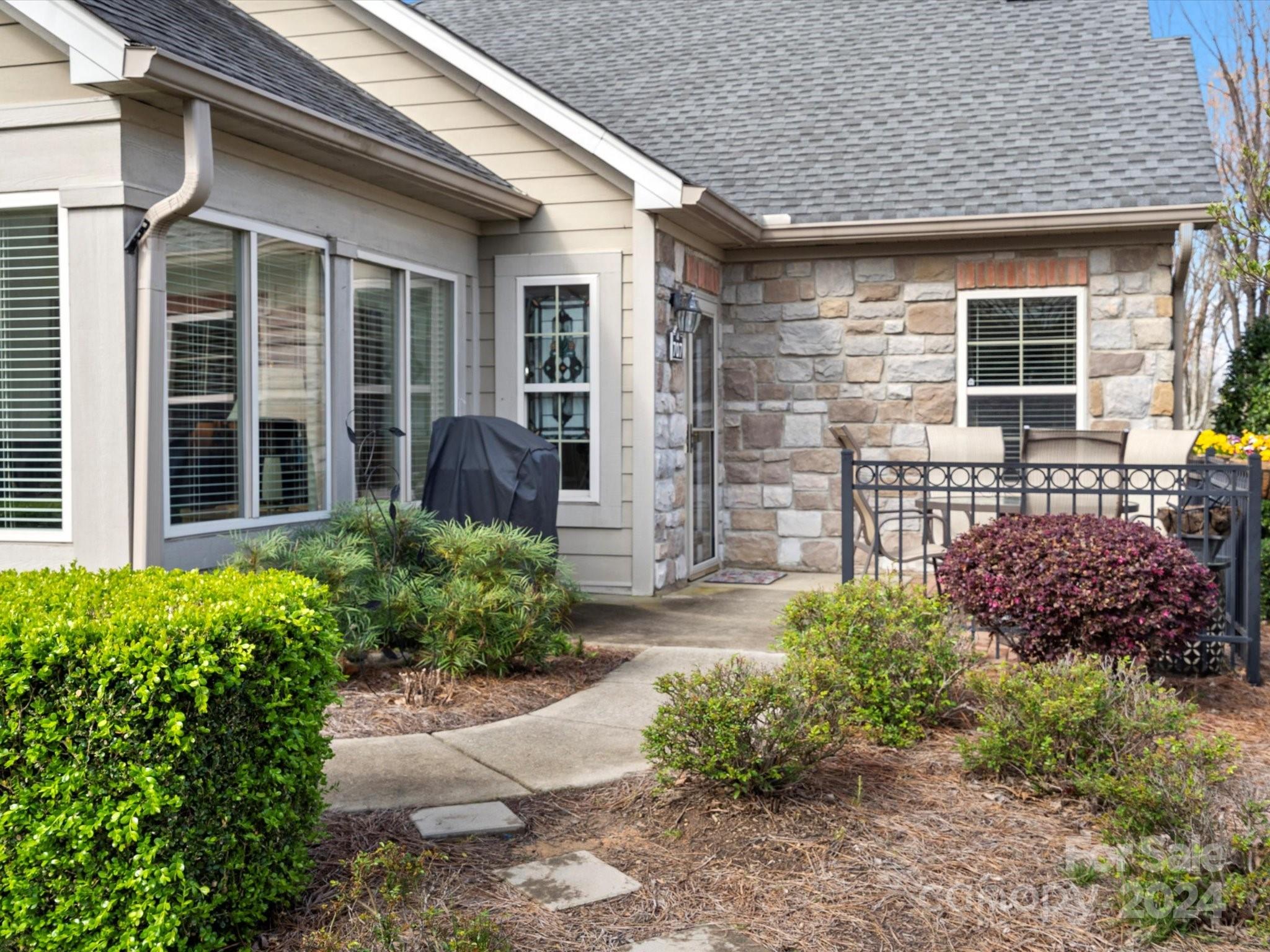 707 Ledgestone Court Fort Mill, SC 29708 - Photo 28 of 40 a front view of a house with garden