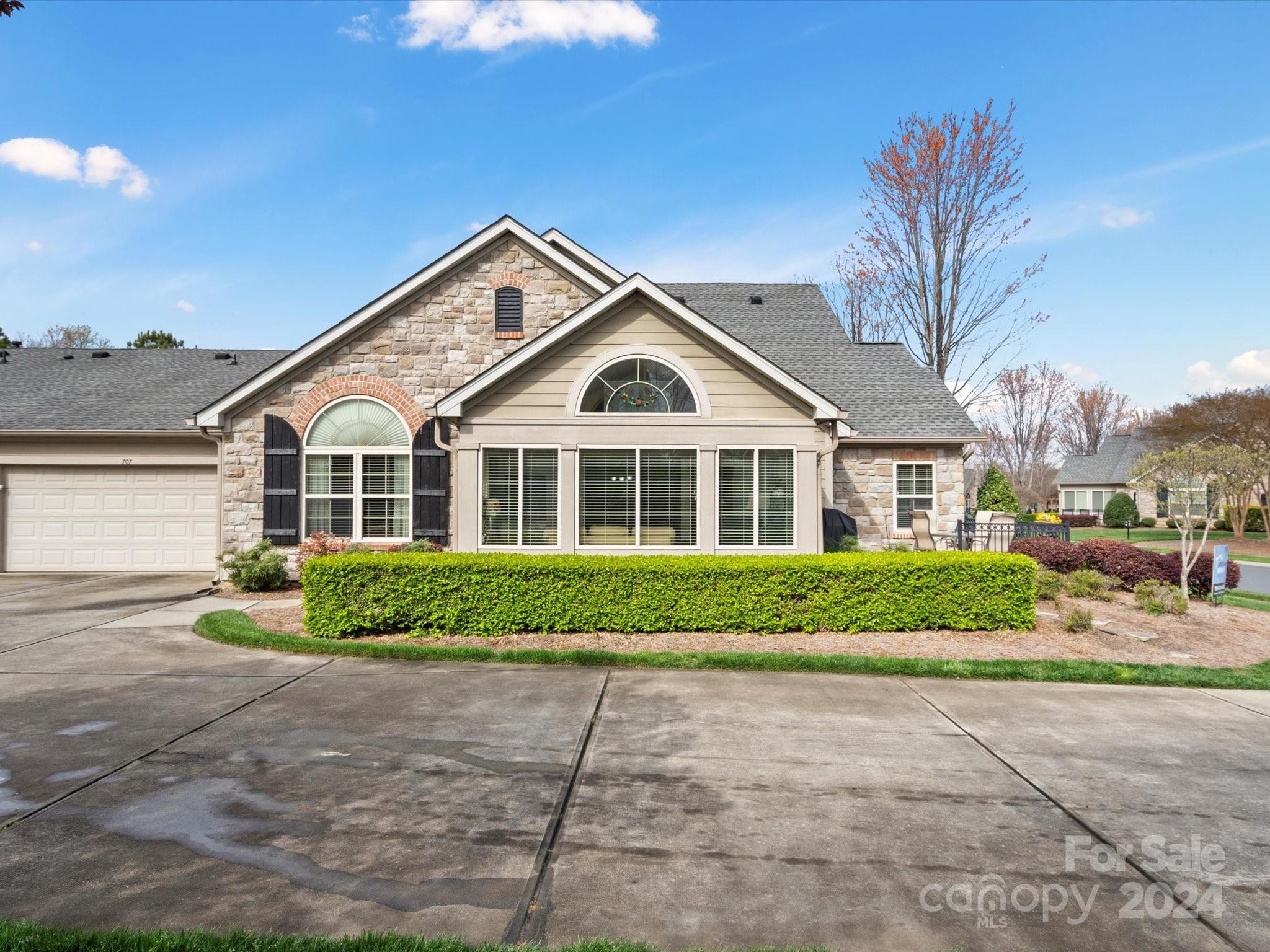 707 Ledgestone Court Fort Mill, SC 29708 - Photo 31 of 40 a front view of a house with a garden