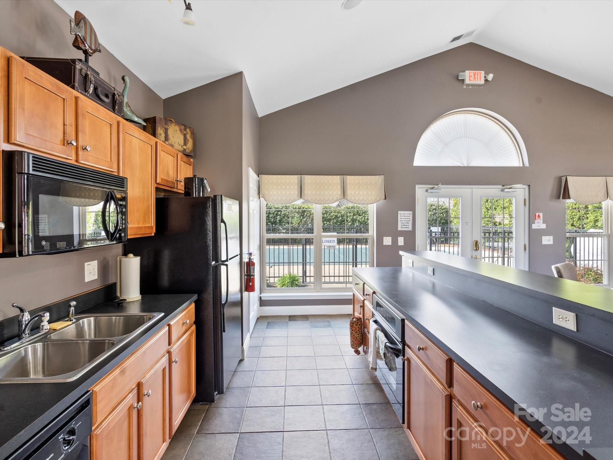 707 Ledgestone Court Fort Mill, SC 29708 - Photo 37 of 40 a large kitchen with a large window and stainless steel appliances