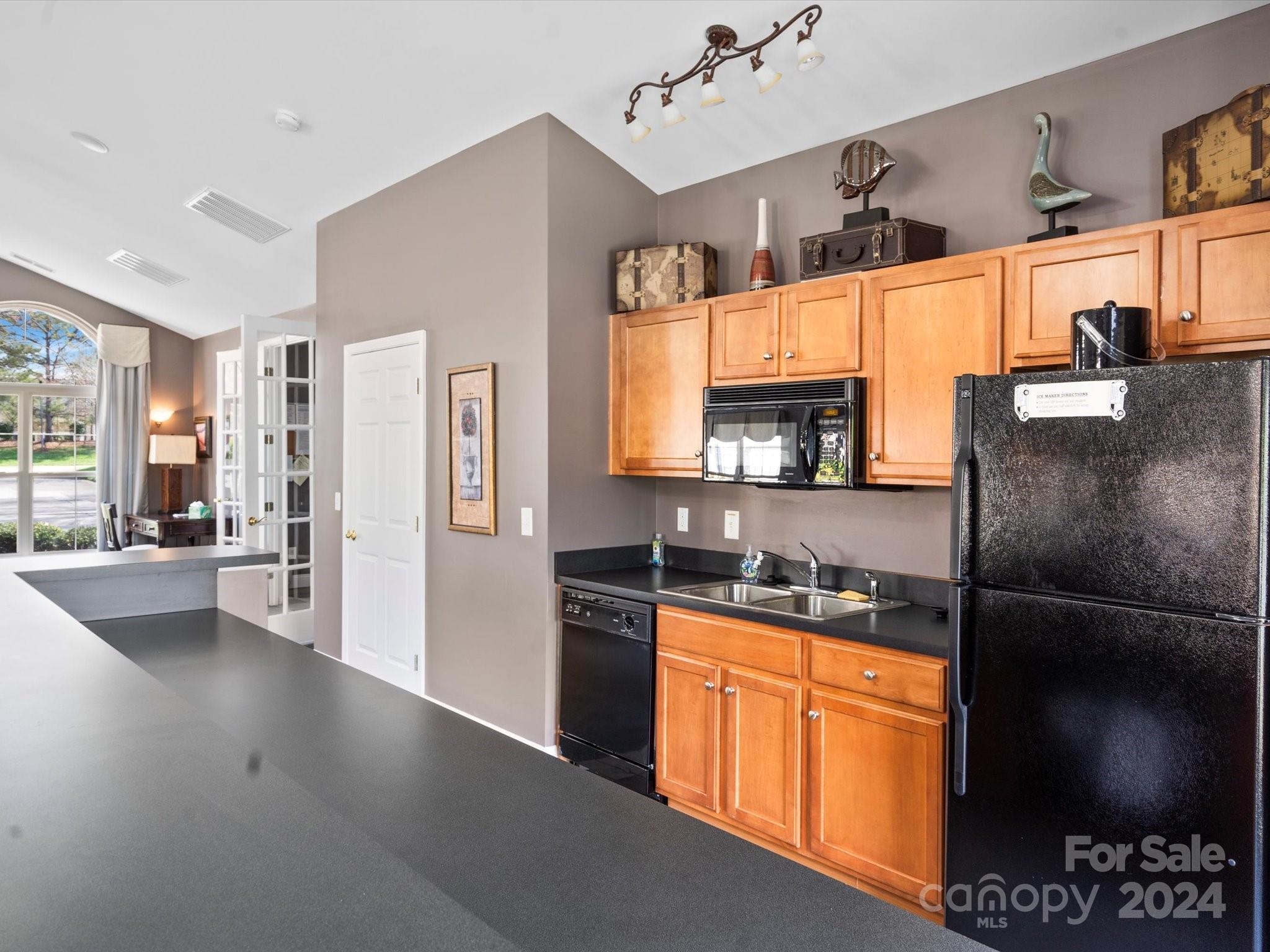 707 Ledgestone Court Fort Mill, SC 29708 - Photo 38 of 40 a kitchen with stainless steel appliances granite countertop a refrigerator and a stove