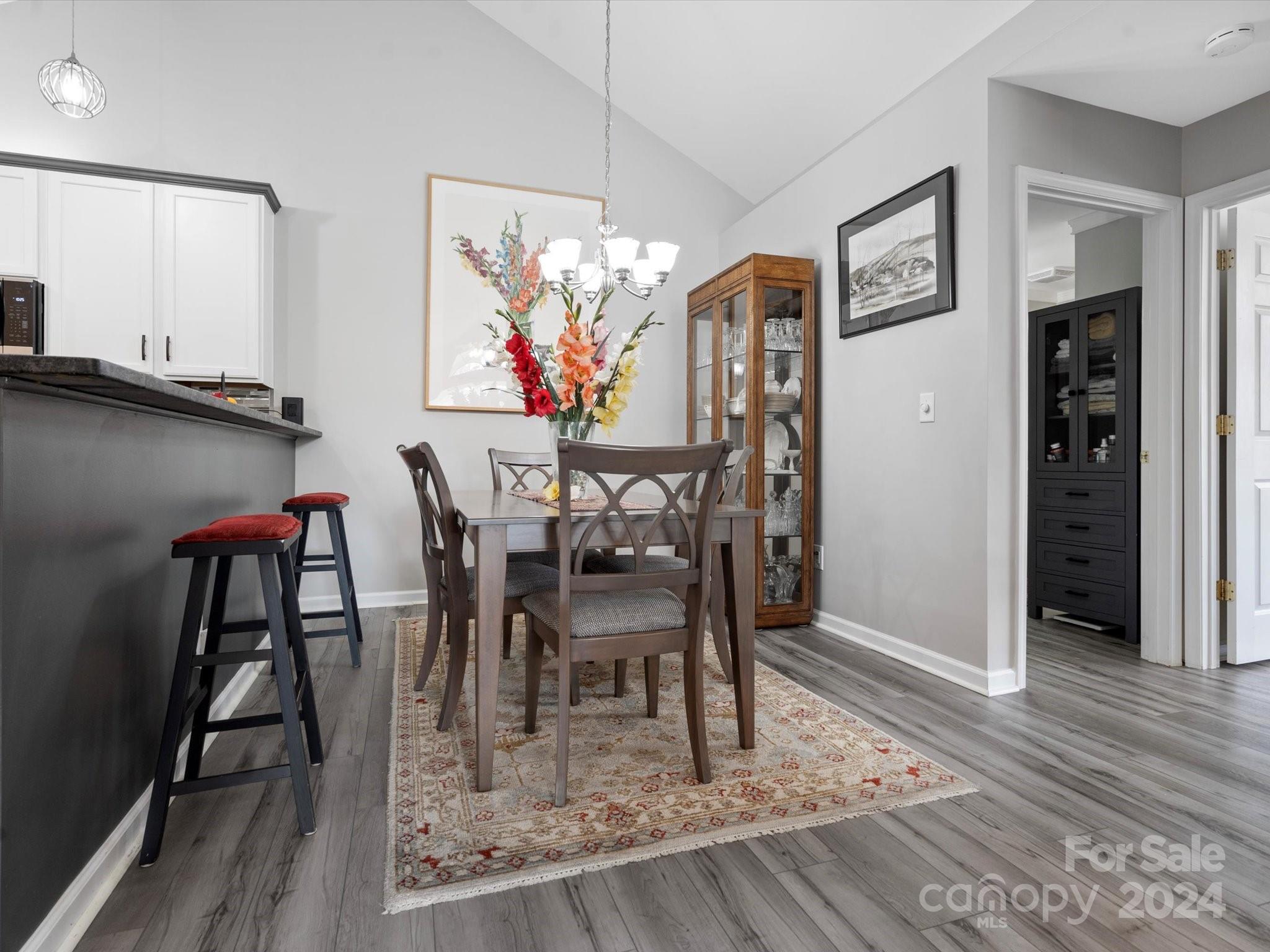 707 Ledgestone Court Fort Mill, SC 29708 - Photo 7 of 40 a dining room with furniture and wooden floor
