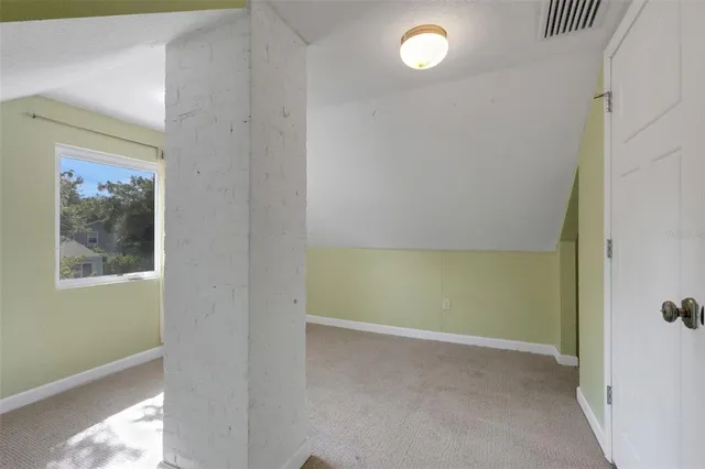 a view of backyard with small cabin and wooden fence