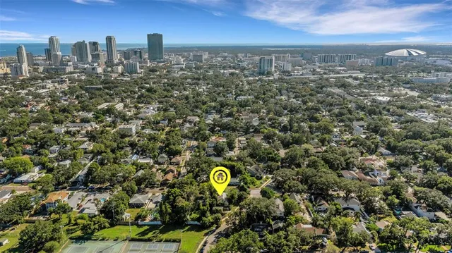 a living room with furniture a ceiling fan and a window