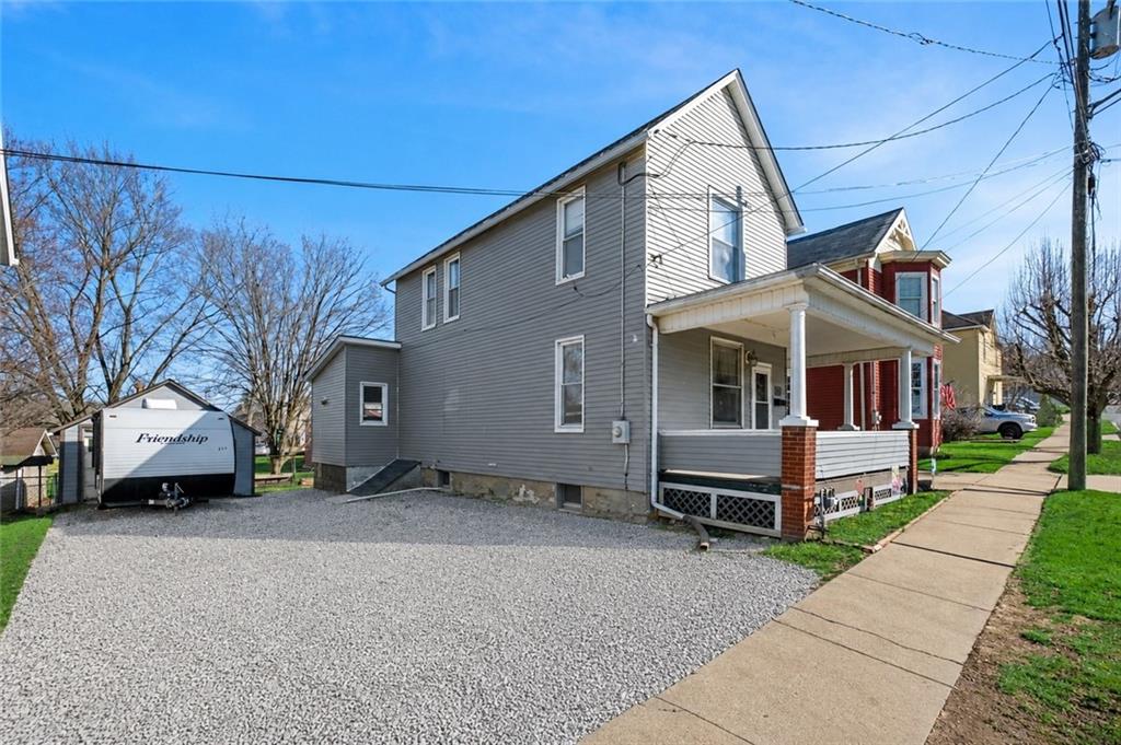 6 West Market Street Burgettstown, PA 15021 - Photo 2 of 24 a front view of a house with a yard