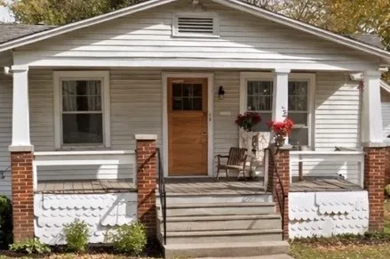 a front view of a house with a porch