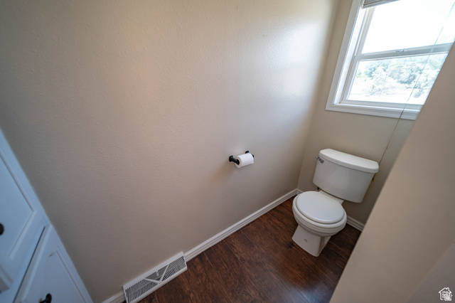 1407 North 1250th Street West Helper, UT 84526 - Photo 20 of 27 Master Bathroom with toilet and dark wood finished floors