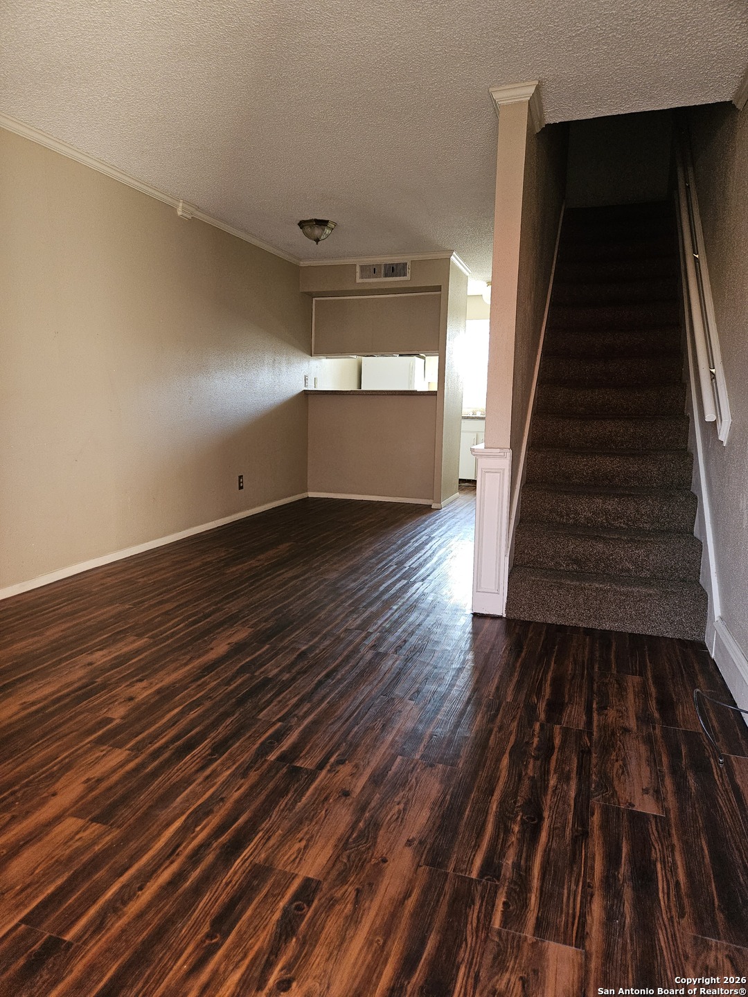 wooden floor in a hall with an entryway