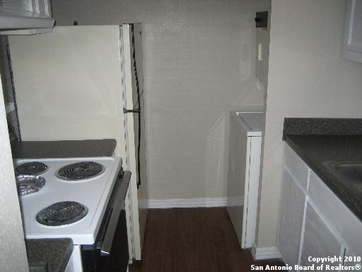3243 Nacogdoches Road, Unit 910 San Antonio, TX 78217 - Photo 2 of 3 a bathroom with a sink and a washing machine