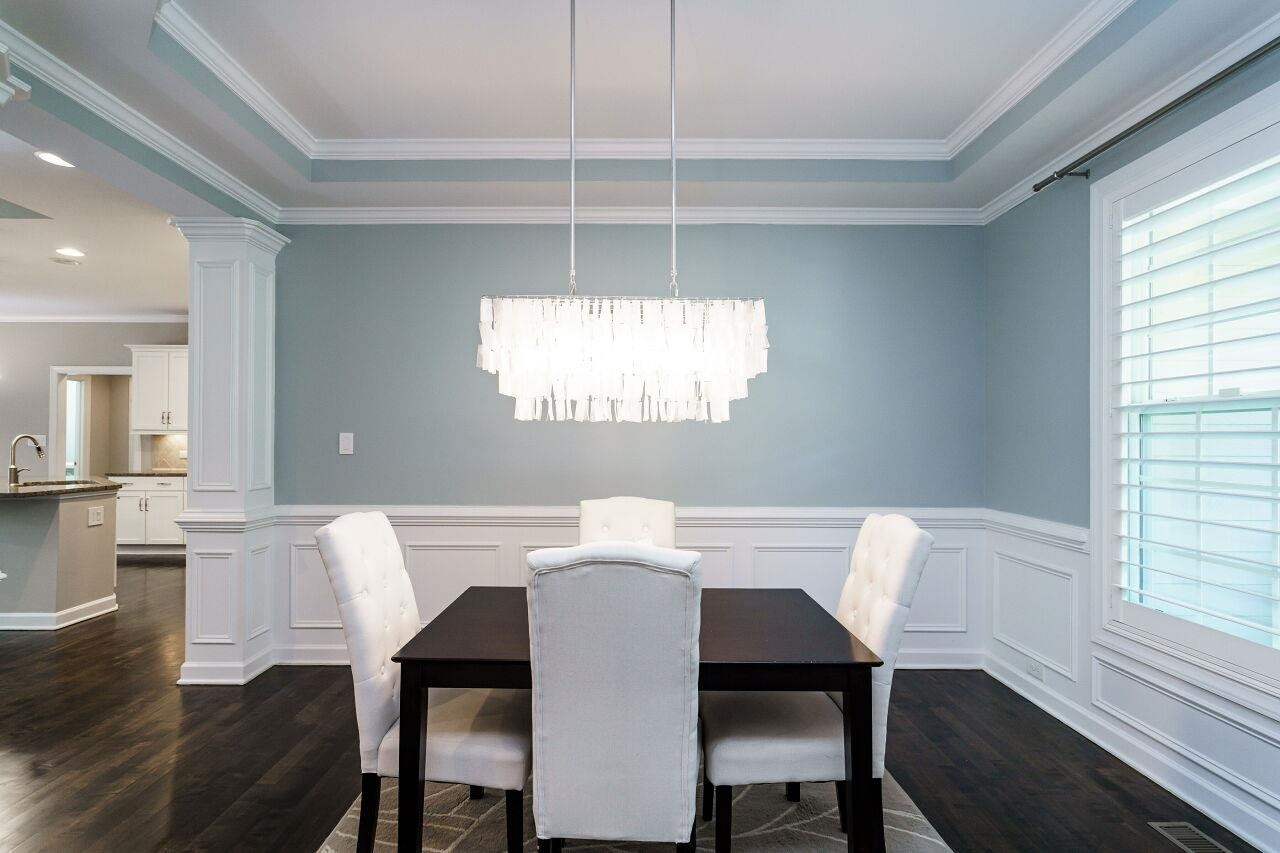 3003 Red Grape Drive Raleigh, NC 27607 - Photo 7 of 35 Additional view of the dining room with columns and stunning fixture! Dining Room