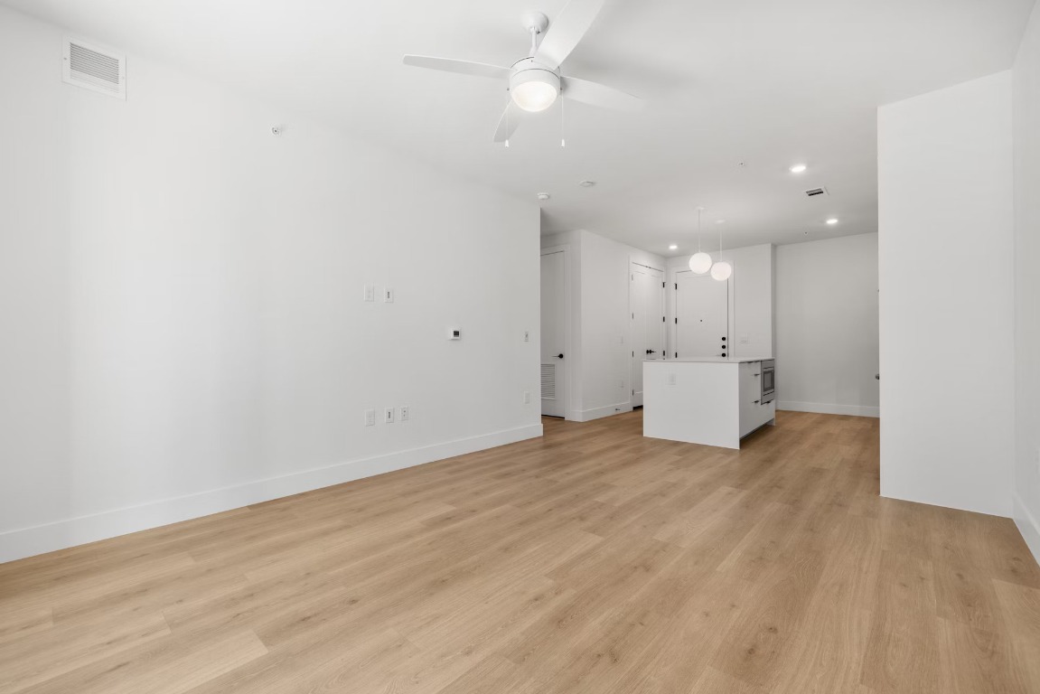 1701 Simond Avenue, Unit 208 Austin, TX 78723 - Photo 11 of 30 a view of a kitchen with a sink and a refrigerator