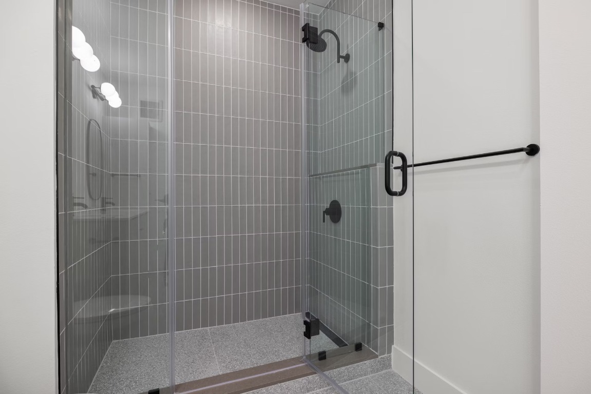 1701 Simond Avenue, Unit 208 Austin, TX 78723 - Photo 14 of 30 a bathroom with a shower