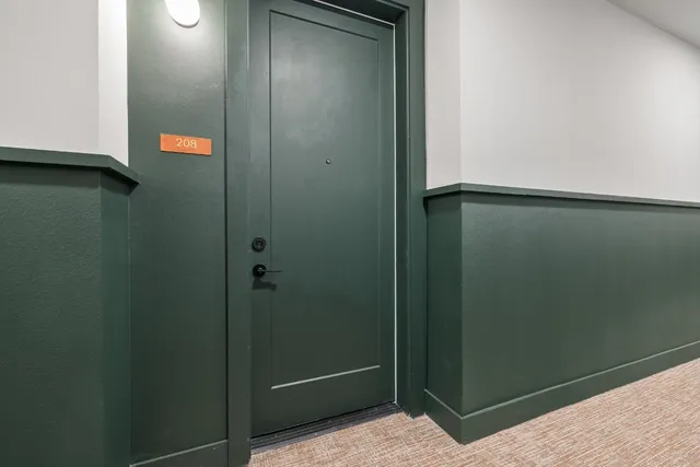 a bathroom with a shower and mirror