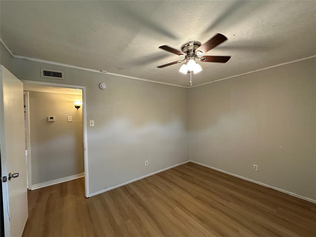 5908 Maple Lane Rowlett, TX 75089 - Photo 12 of 25 wooden floor in an empty room