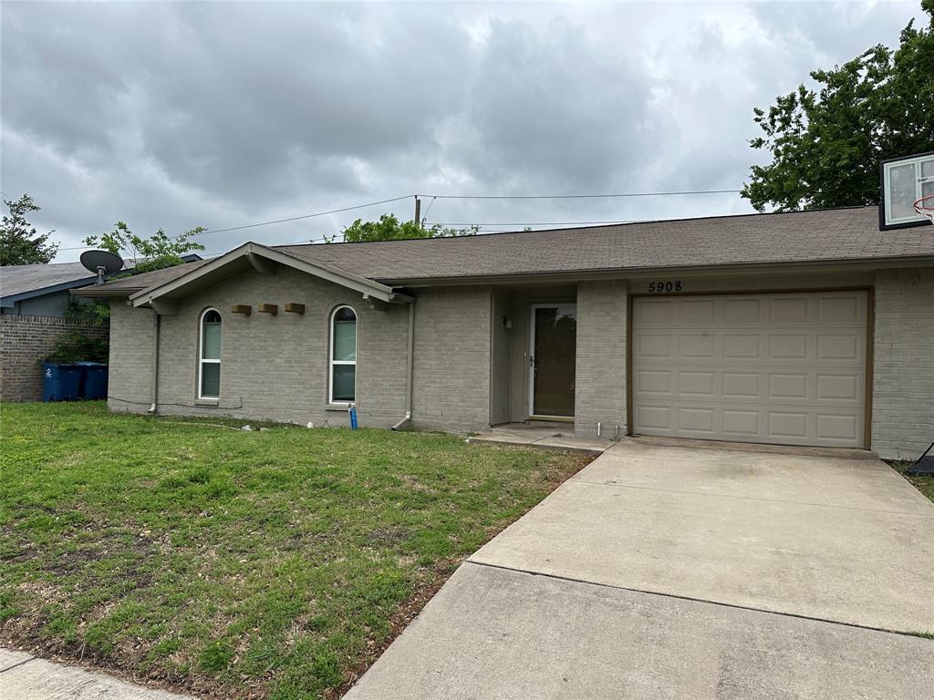 5908 Maple Lane Rowlett, TX 75089 - Photo 2 of 25 a house with yard in front of it