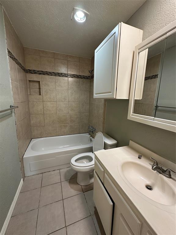 5908 Maple Lane Rowlett, TX 75089 - Photo 23 of 25 a bathroom with a sink a toilet and bathtub