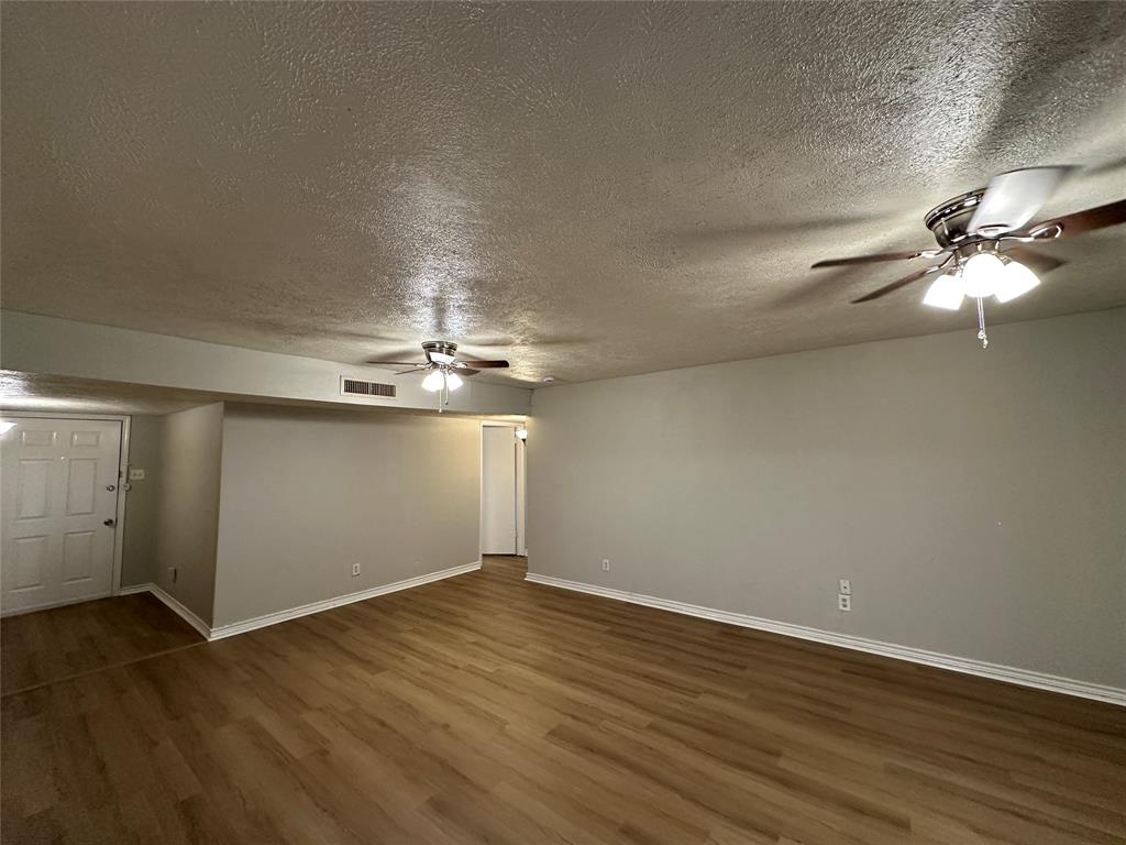 5908 Maple Lane Rowlett, TX 75089 - Photo 4 of 25 a view of a room with wooden floor