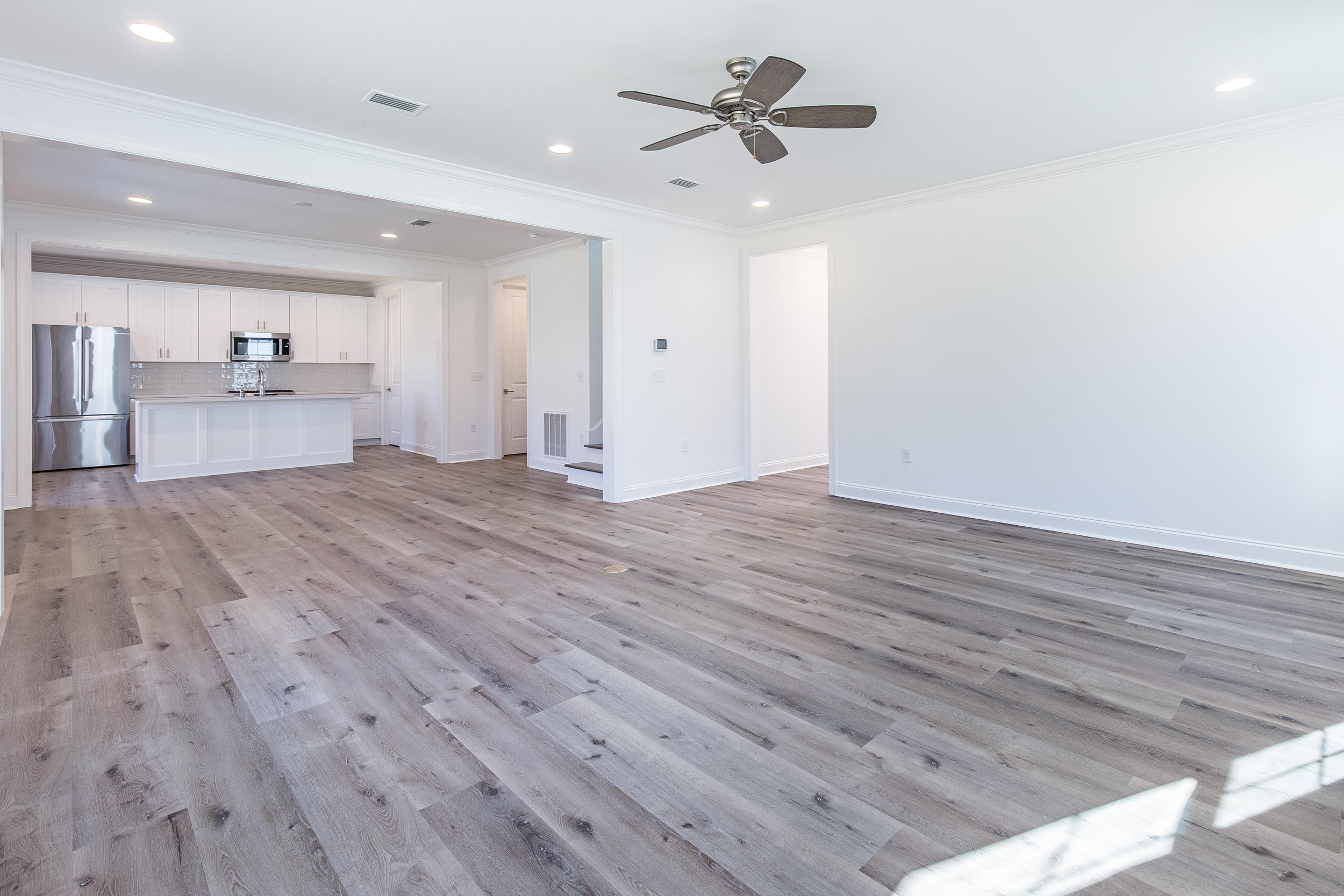 129 Windrow Way, Unit LOT 252 Watersound, FL 32461 - Photo 8 of 38 a view of empty room with wooden floor and window