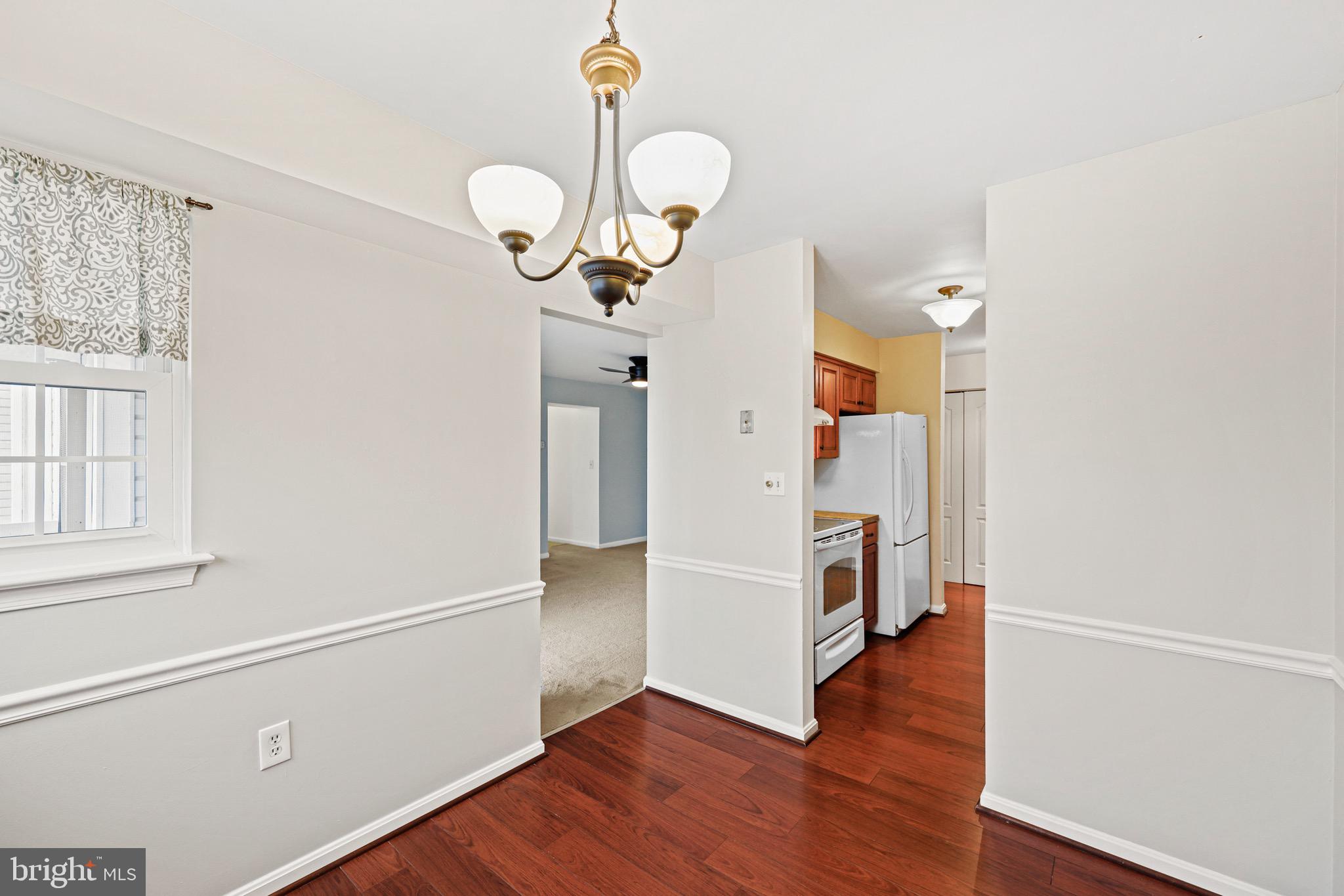 8384 Montgomery Run Road, Unit G Ellicott City, MD 21043 - Photo 13 of 28 Dining Room with view into Living Room and Kitchen