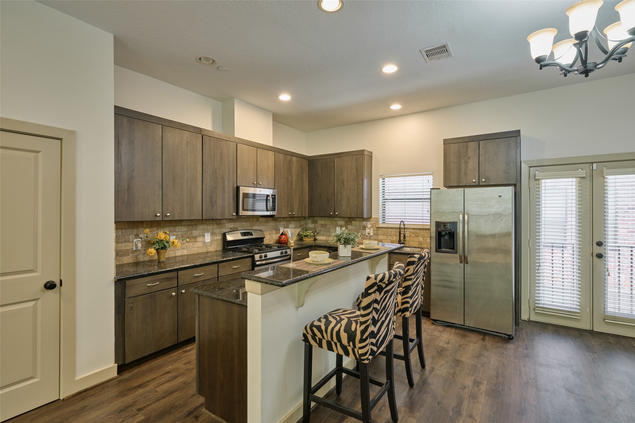 2422 Navigation Boulevard, Unit E Houston, TX 77003 - Photo 14 of 29 a kitchen with a sink a refrigerator and wooden floor
