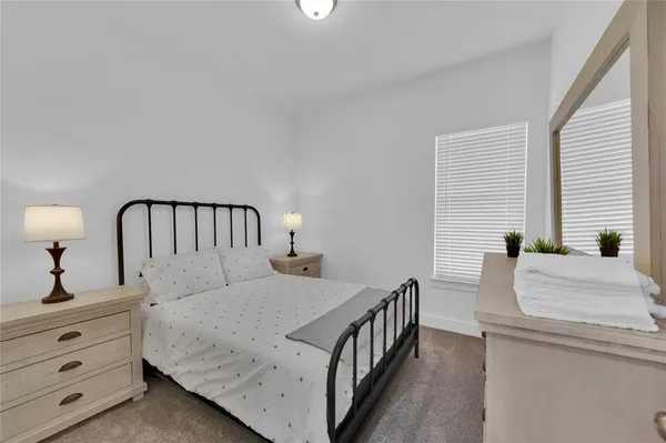 a front view of a house with yard and garage