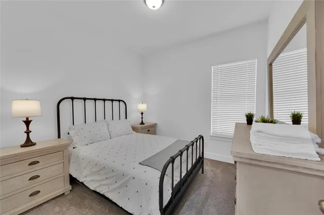 a front view of a house with yard and garage