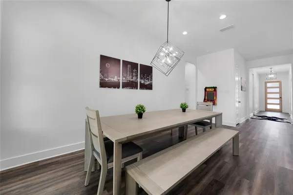 a bedroom with a bed and a potted plant