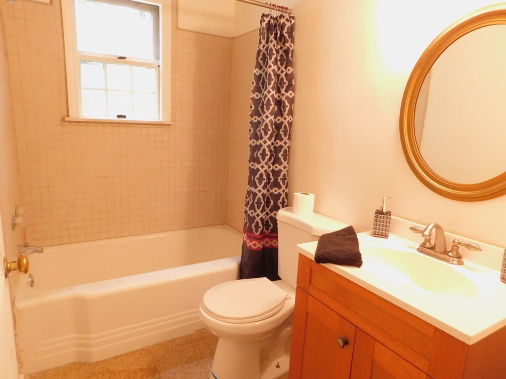 75 Anniversary Street Springfield, MA 01104 - Photo 11 of 12 a bathroom with a sink toilet and shower