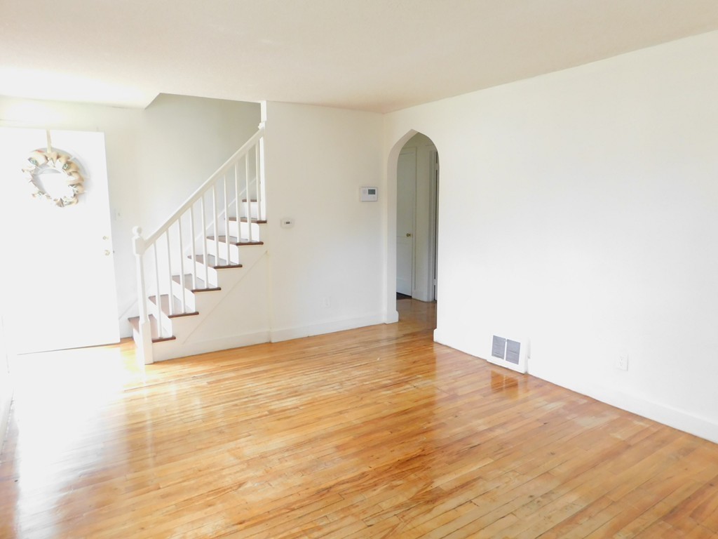 75 Anniversary Street Springfield, MA 01104 - Photo 5 of 12 a view of an empty room with wooden floor