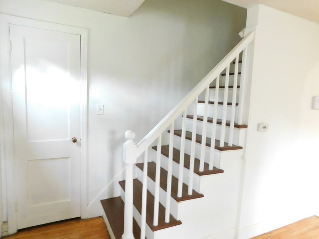 75 Anniversary Street Springfield, MA 01104 - Photo 6 of 12 a view of staircase with wooden floor