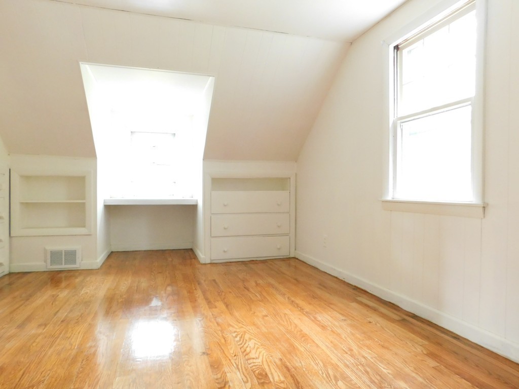 75 Anniversary Street Springfield, MA 01104 - Photo 7 of 12 an empty room with a natural light