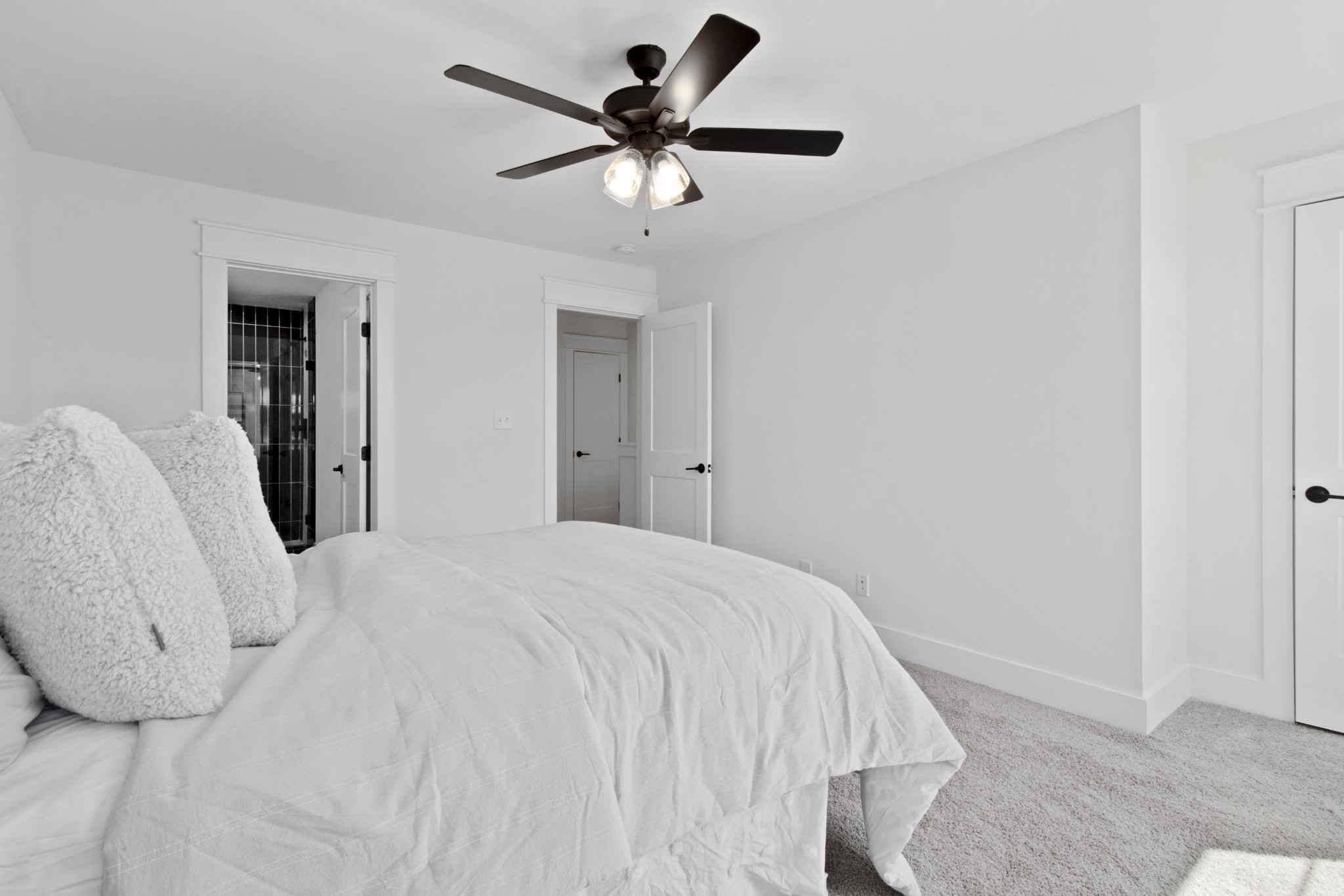 41 West High Street, Unit D6 Clarksville, TN 37040 - Photo 18 of 29 a bedroom with a bed and a ceiling fan