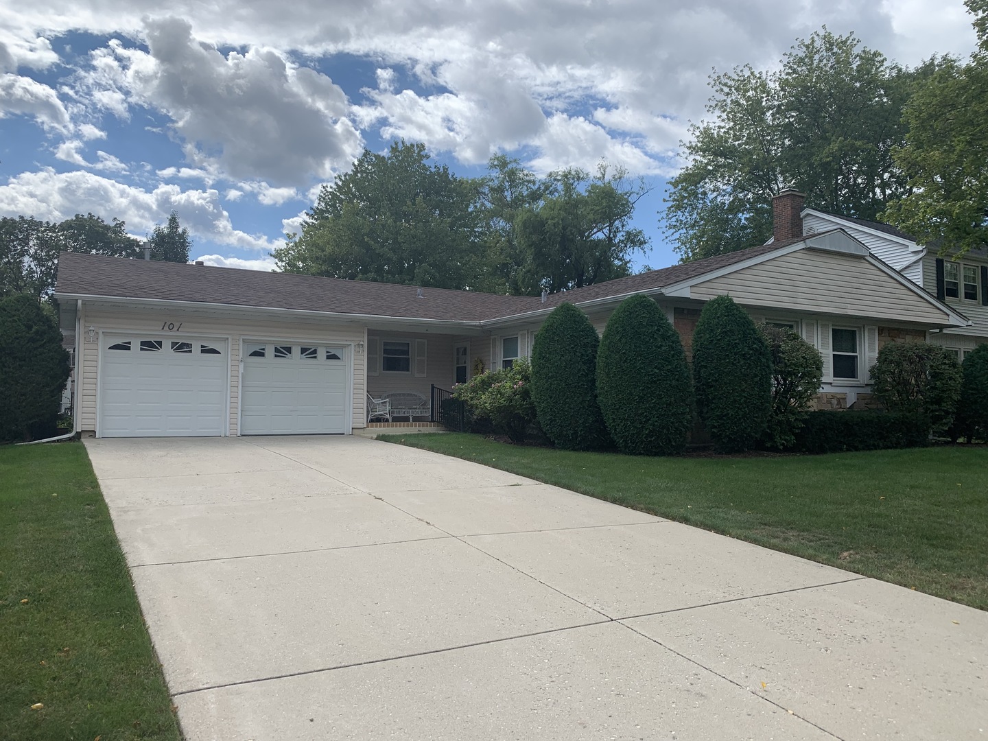 101 Stonegate Road Buffalo Grove, IL 60089 - Photo 1 of 18 a front view of a house with garden