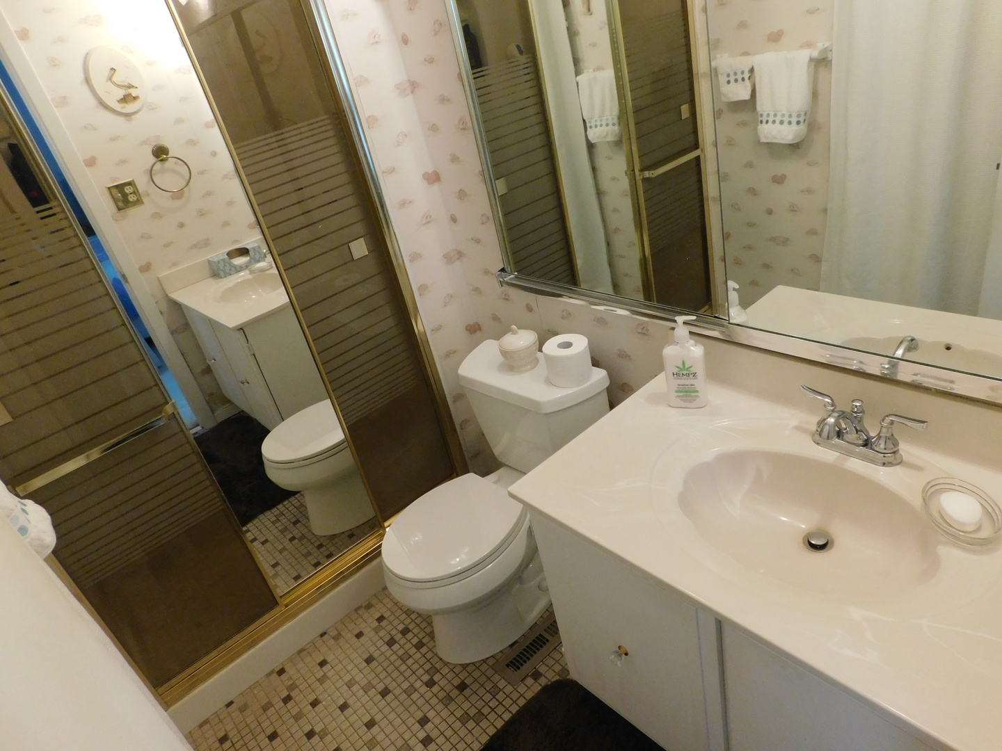 101 Stonegate Road Buffalo Grove, IL 60089 - Photo 13 of 18 a bathroom with a sink and a mirror