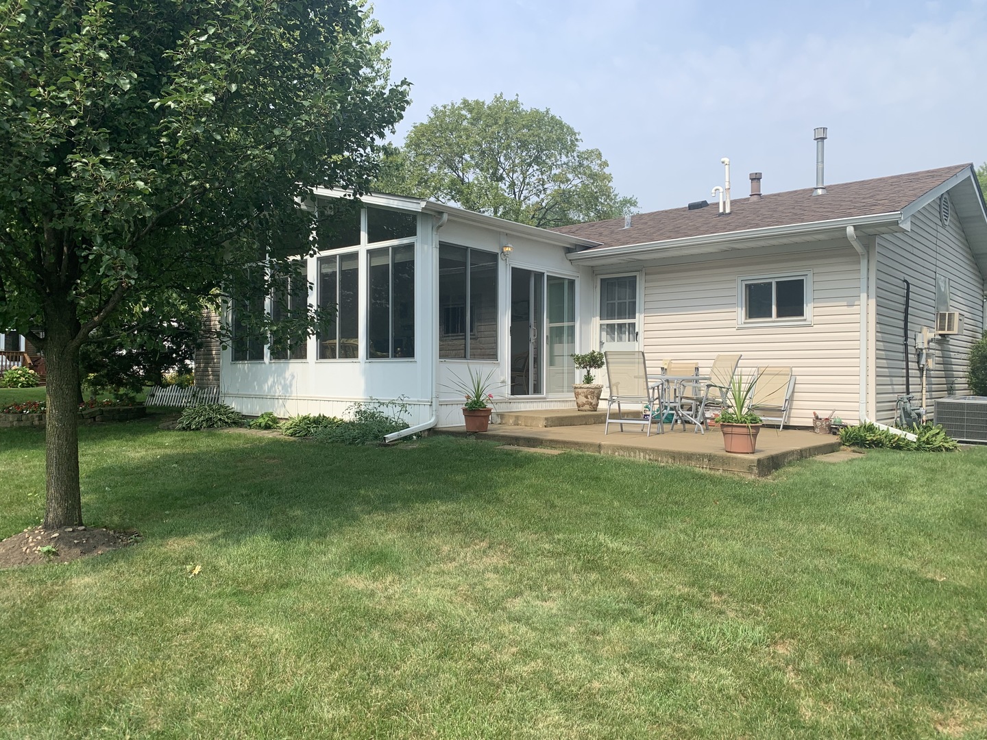 101 Stonegate Road Buffalo Grove, IL 60089 - Photo 17 of 18 a front view of house with yard and outdoor seating