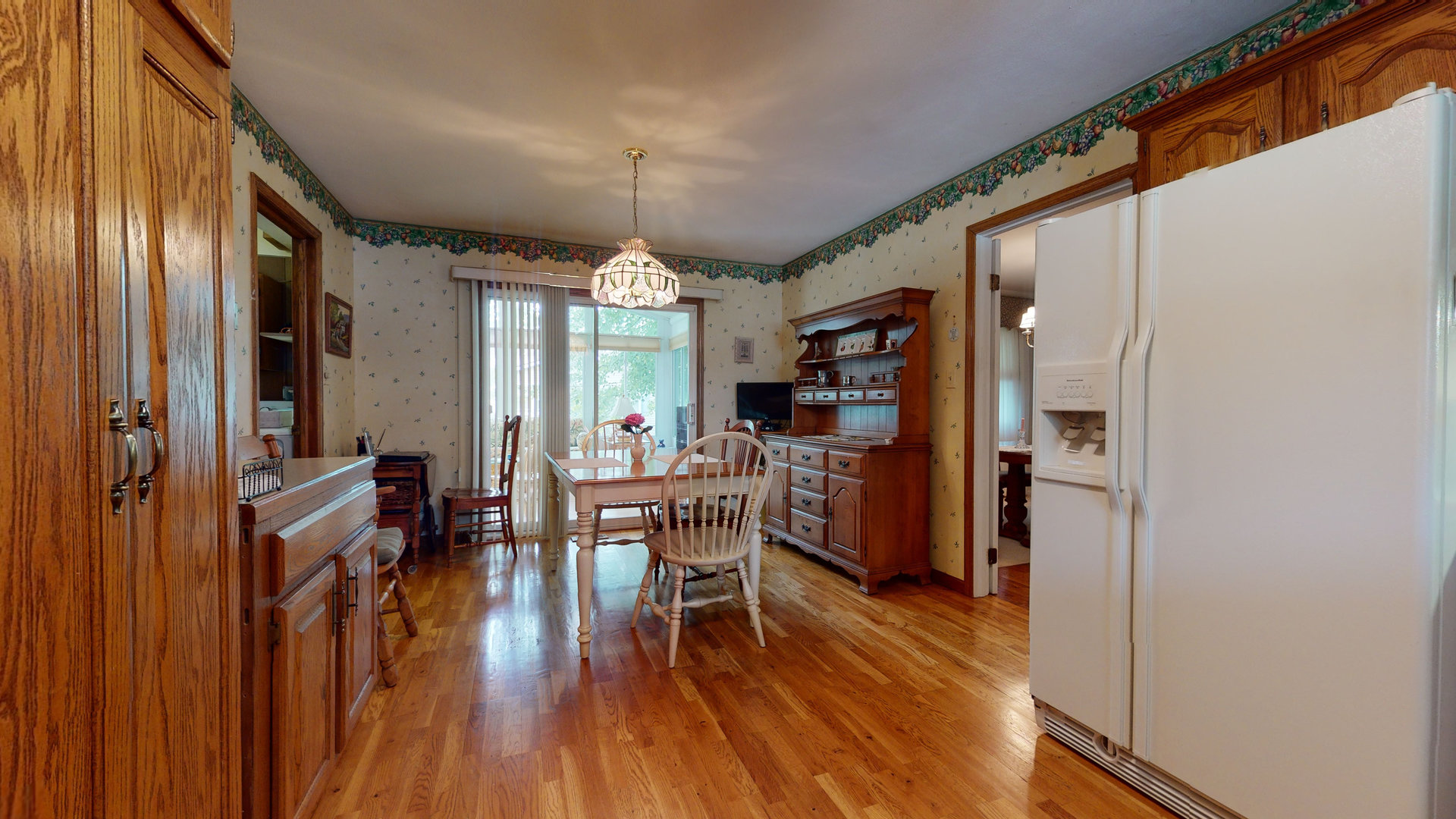 101 Stonegate Road Buffalo Grove, IL 60089 - Photo 4 of 18 a view of a dining room with furniture window and wooden floor