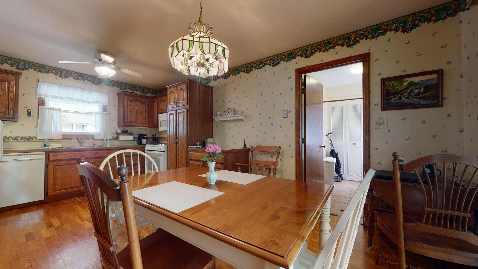 101 Stonegate Road Buffalo Grove, IL 60089 - Photo 5 of 18 a view of a dining room with furniture window and wooden floor
